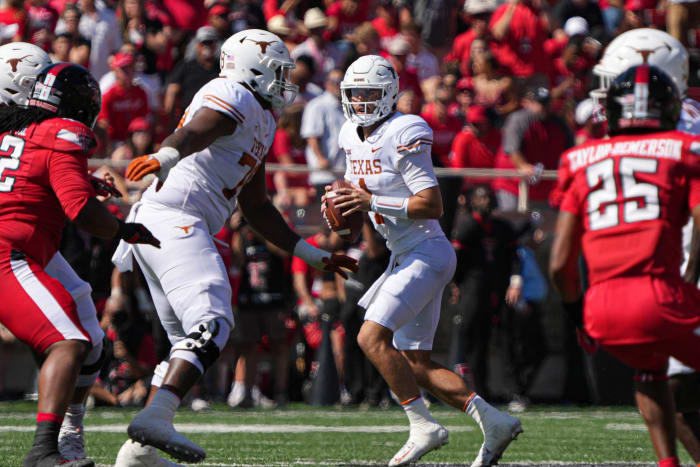 Sep 24, 2022; Lubbock, Texas, USA; Texas Longhorns quarterback Hudson Card (1) looks for an open receiver against the Texas Tech Red Raiders during a game at Jones AT&T Stadium.